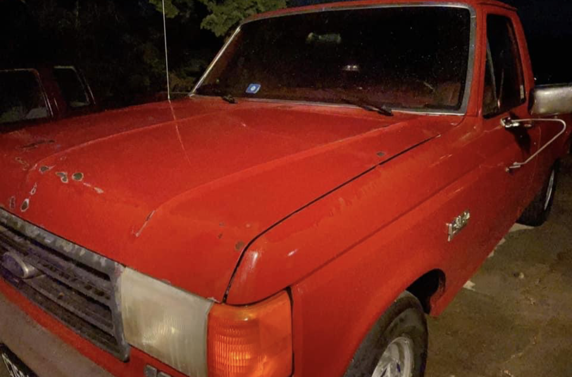 shined red ford truck