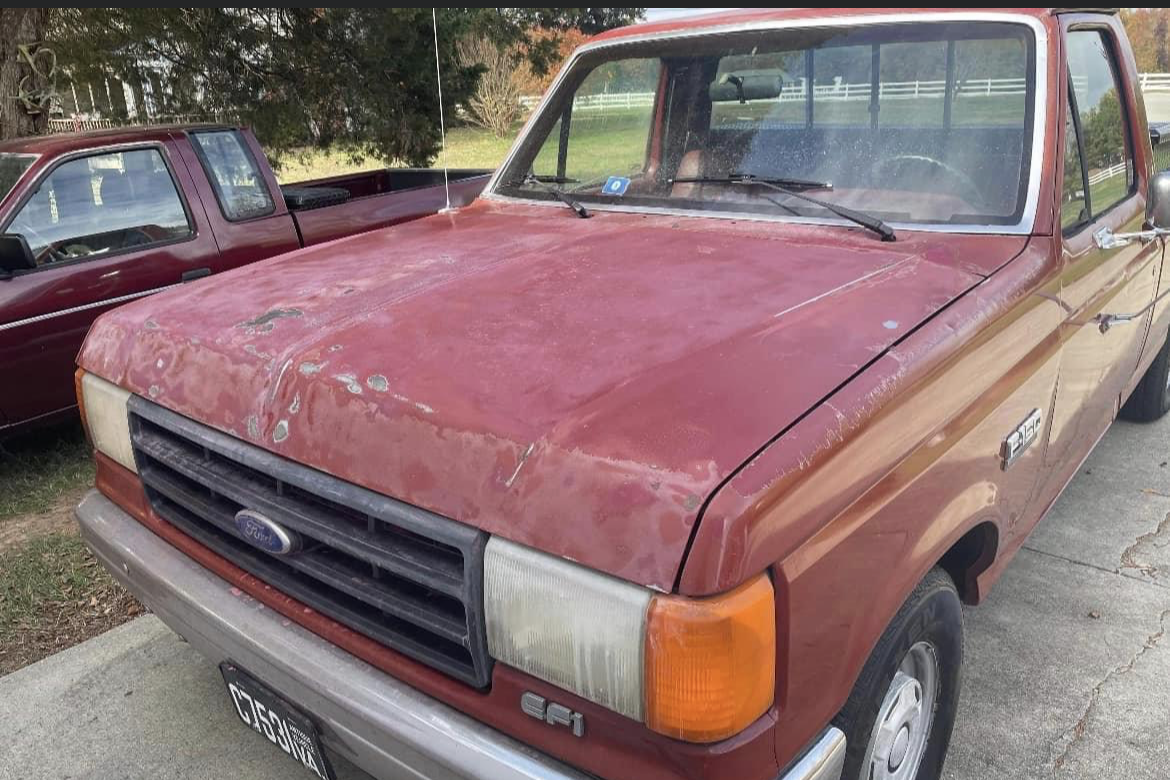 dirty red ford truck